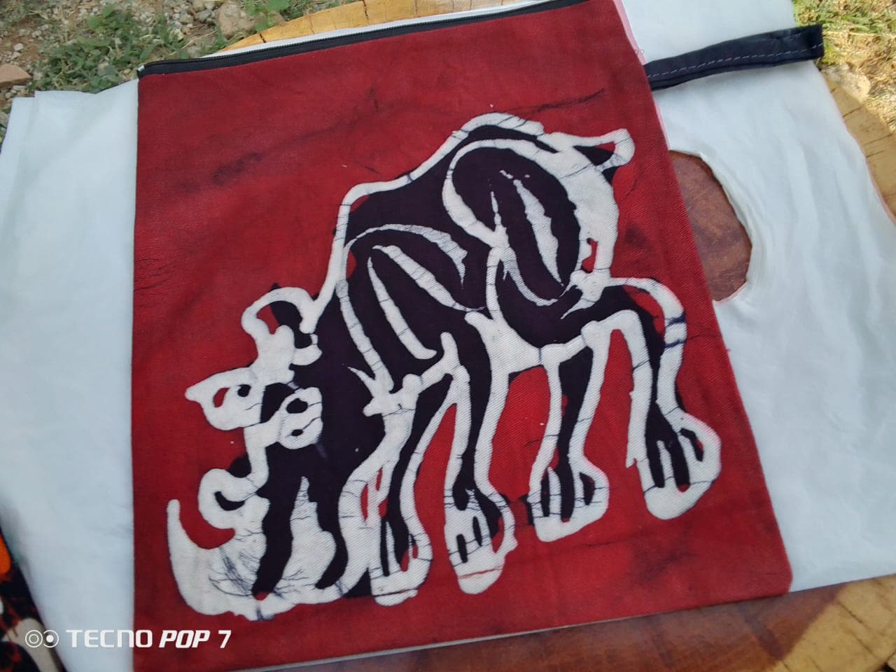 Batik makeup bag with rhino print – Red batik makeup bag with rhino print