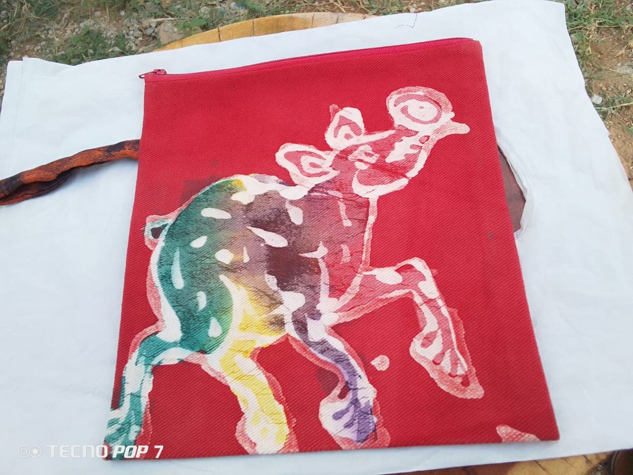Batik makeup bag with multicolored animal print – Red makeup bag with multicolored elephant print