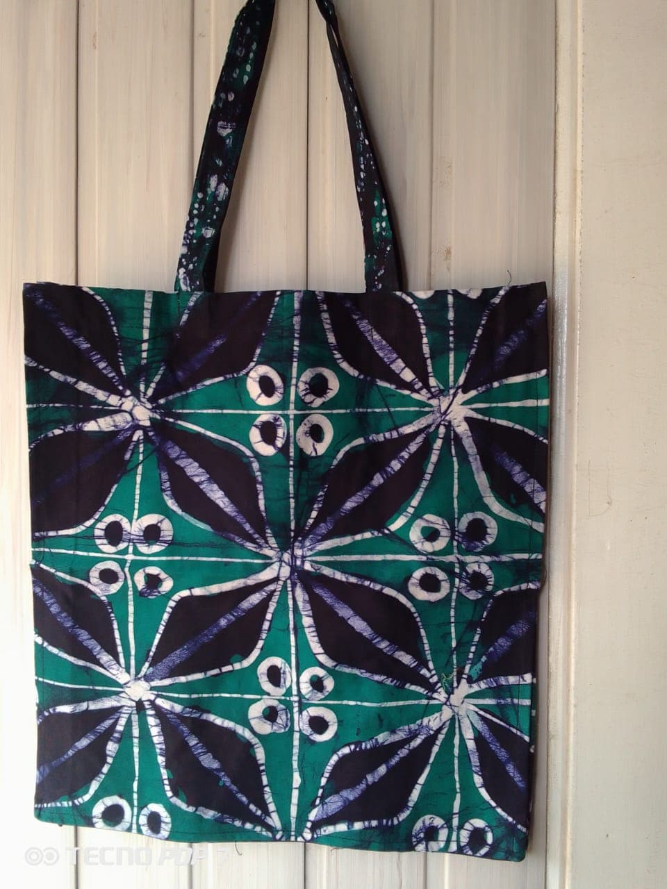 Bold mosaic patterned circles in a star – Green and purple mosaic pattern looks like four eyes in a star